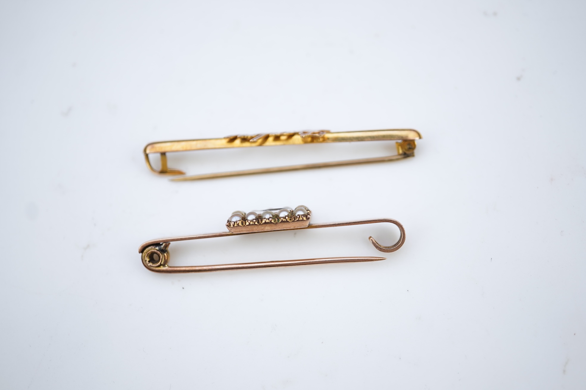 Two bar brooches